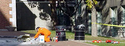 A technician from the HWM deals safely and efficiently with a chemical waste spill during an emergency