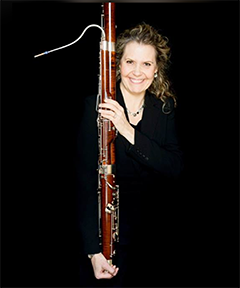 suzanne-nelsen-standing-holding-bassoon