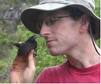 Prof. Andrew Hendry with finch in Galapagos