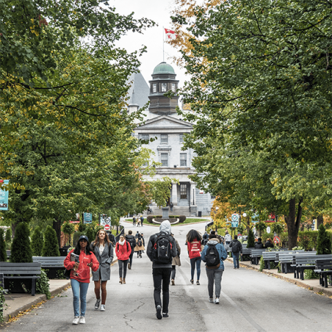 students walking to the arts building