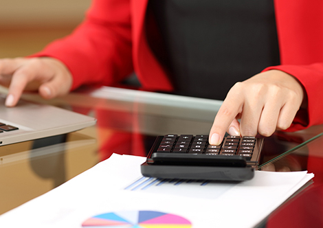 Photo of a person using a calculator