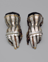 Gloves of a medieval armor set, silver, with mesh details