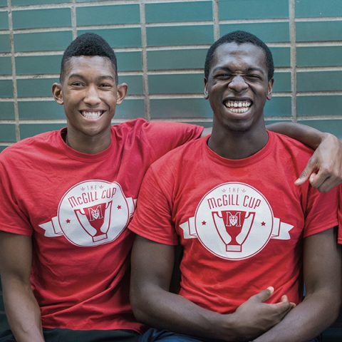 Two Black students in McGill shirts smiling