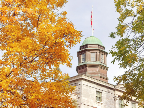 Cupola of the Arts building on McGill campus and foilage from surrounding trees