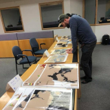 Printed sea ice maps on a table