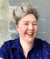 A picture containing a person smiling
