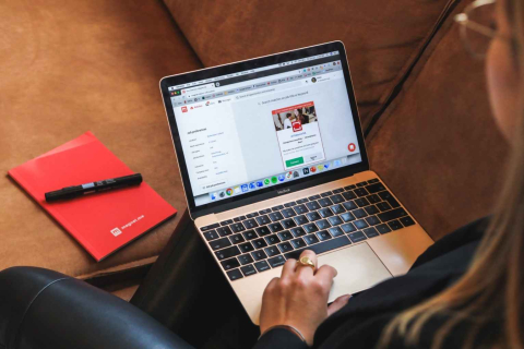 Student researching on laptop