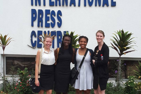 Four interns outside the International Press Centre.