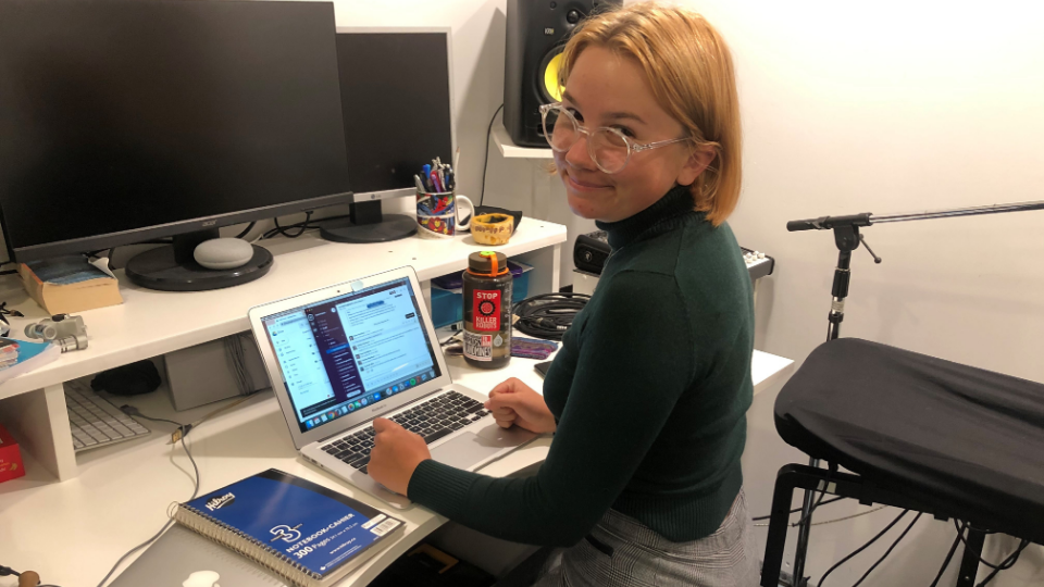 Magritte Gordaneer working at her desk during the course of her internship with the Canadian Voice of Women for Peace.