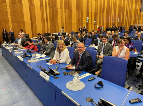 Sebastian, Ambassador Lulashnyk, and members of the Canadian delegation at Canada’s desk in the plenary, preparing for the 32nd Session of CCPCJ.