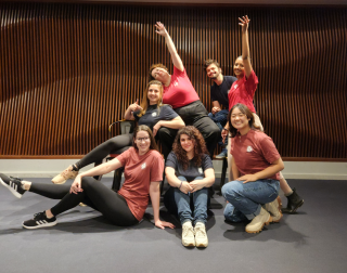 The Festival Accès Asie team posing to promote their new t-shirt merchandise on social media.