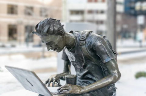 sculpture of a student with laptop at mtl