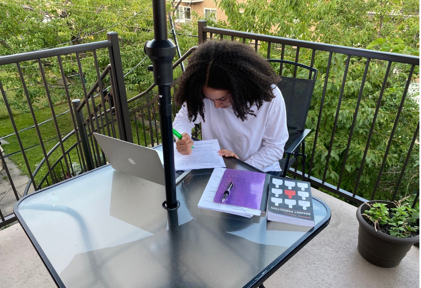 A student studying with her laptop