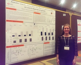 Dana standing with her poster. 
