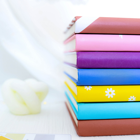 Stack of colourful notebooks 