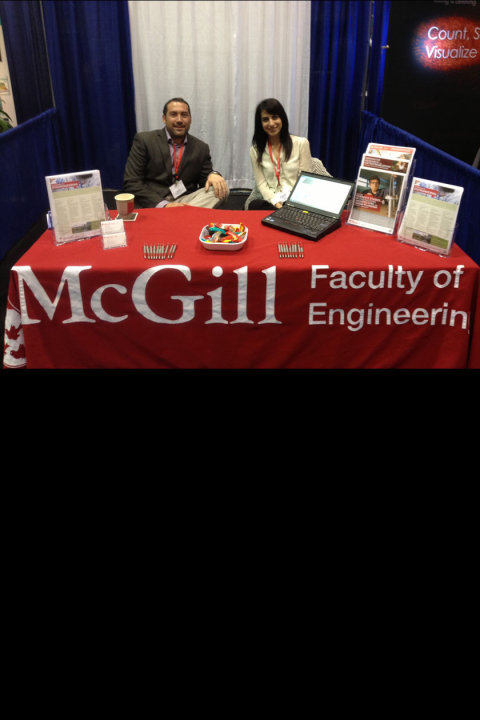 Picture of Dr. Matt Kinsella and Antonella Fratino at the McGill Bioengineering Booth at BMES 2013