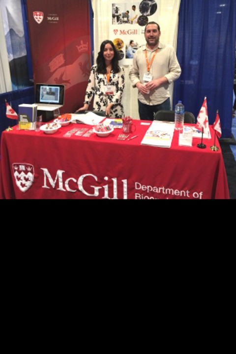 Rosalie Nardelli and Prof. Matt Kinsella standing at the McGill Bioengineering booth at the Biomedical Engineering Society conference