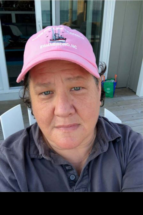 Picture of Dr. Jackie Vogel with pink baseball cap
