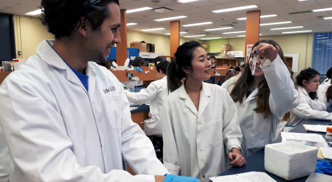 students in lab coats 