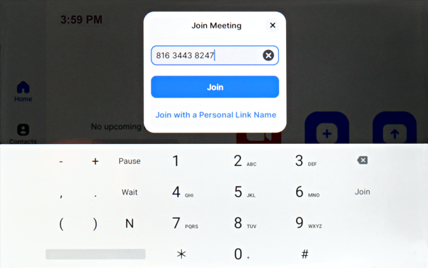 Zoom Room controller with meeting ID typed in.