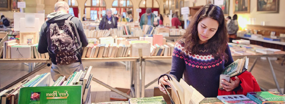 Students looking at books at the book fair