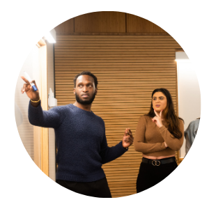 a male student and female looking at a balckboard
