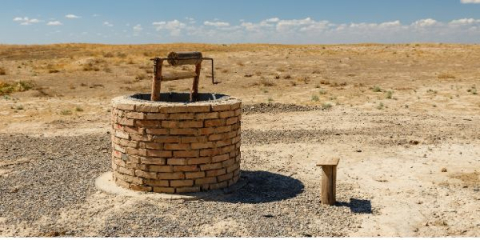 a brick well in a desert