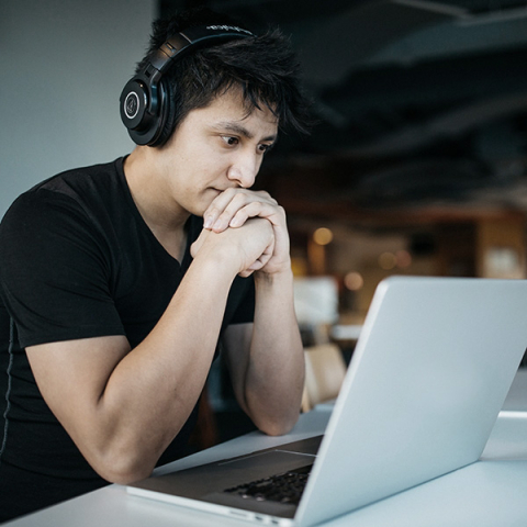 Student looking at his laptop