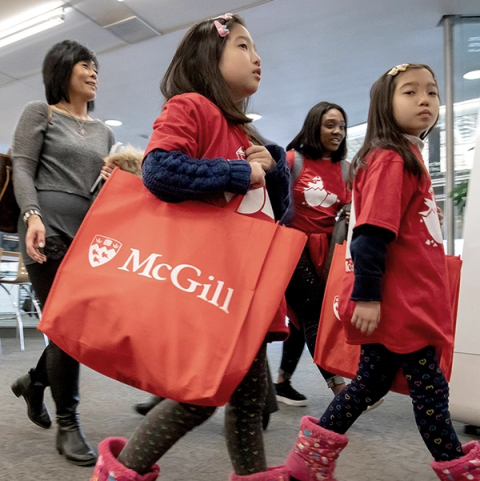 elementary students carrying a McGill tote bag