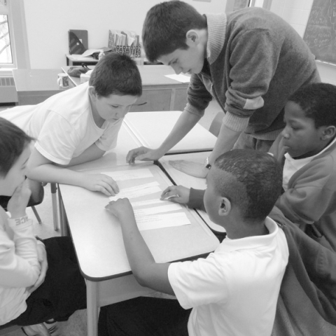 mentors and mentees working on a project