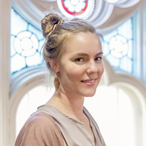 female student looking at the camera and smiling