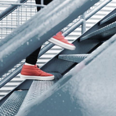 person climbing up the stairs