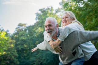 Older couple having fun and piggybacking