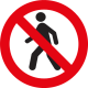 Cercle rouge avec une barre oblique au-dessus d'une icône représentant une personne qui marche