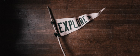 Triangular flag labelled with"Explore"