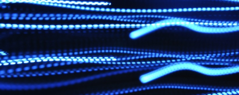Blue electrical streaks over a black background