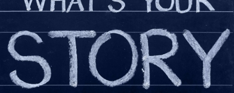 "What's Your Story" written on a chalkboard