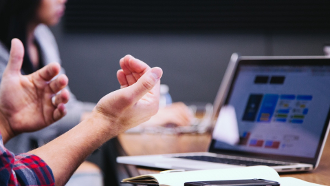 hands, laptop computer and phone