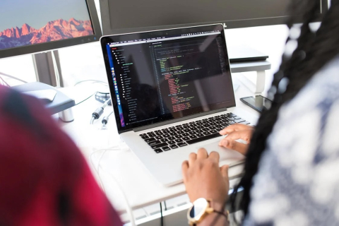 Person laptop coding