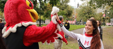 Marty the Martlet and a McGill cheerleader at a Centraide event