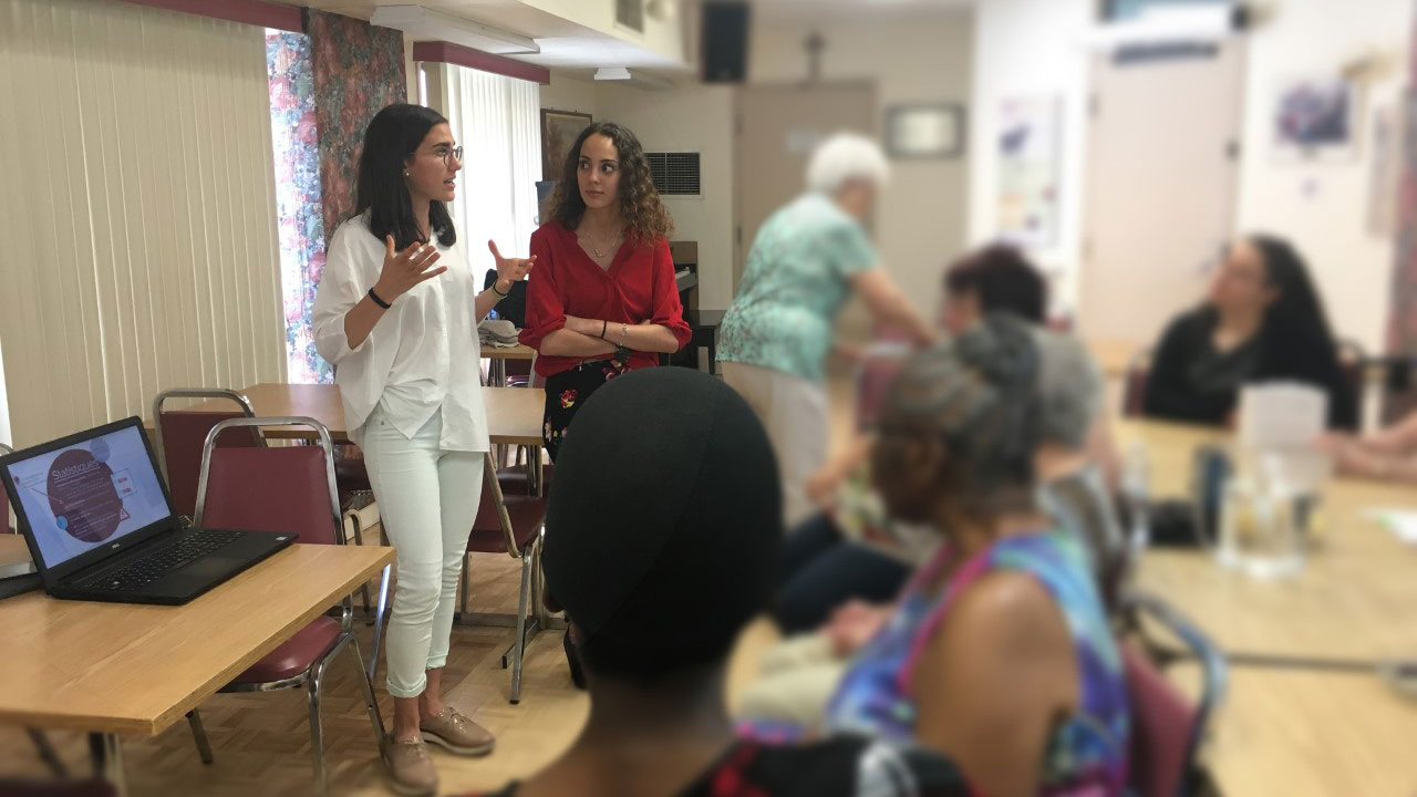 Anne doing a conference in a community centre for seniors