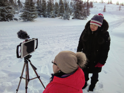 Christine Ha filming outdoors