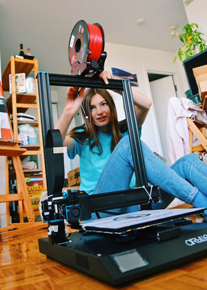 Celeste working on a 3D printer