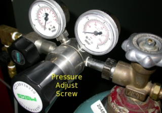 Step 7:  Turn the pressure adjusting screw on the regulator 