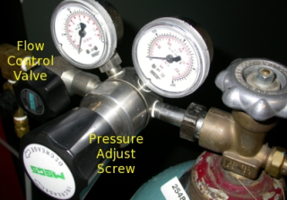 Step 14: When gauges fall to zero, turn the pressure adjusting 