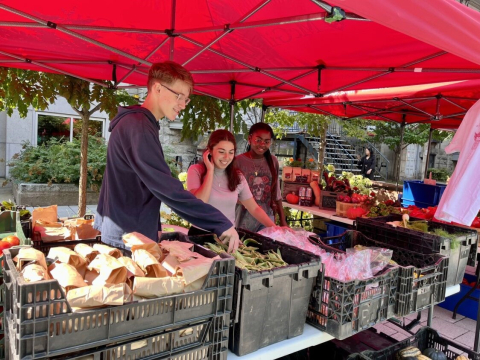 Volunteers at McGill's farmer's market on McTavish street.