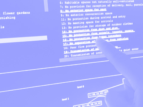 Snapshot of the HIDECS reconstruction in blue and white duotone. The image shows a finger pointing to text on a screen. 