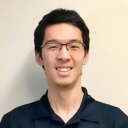 Portrait of Zijian - Young man with glasses smiling at the camera 