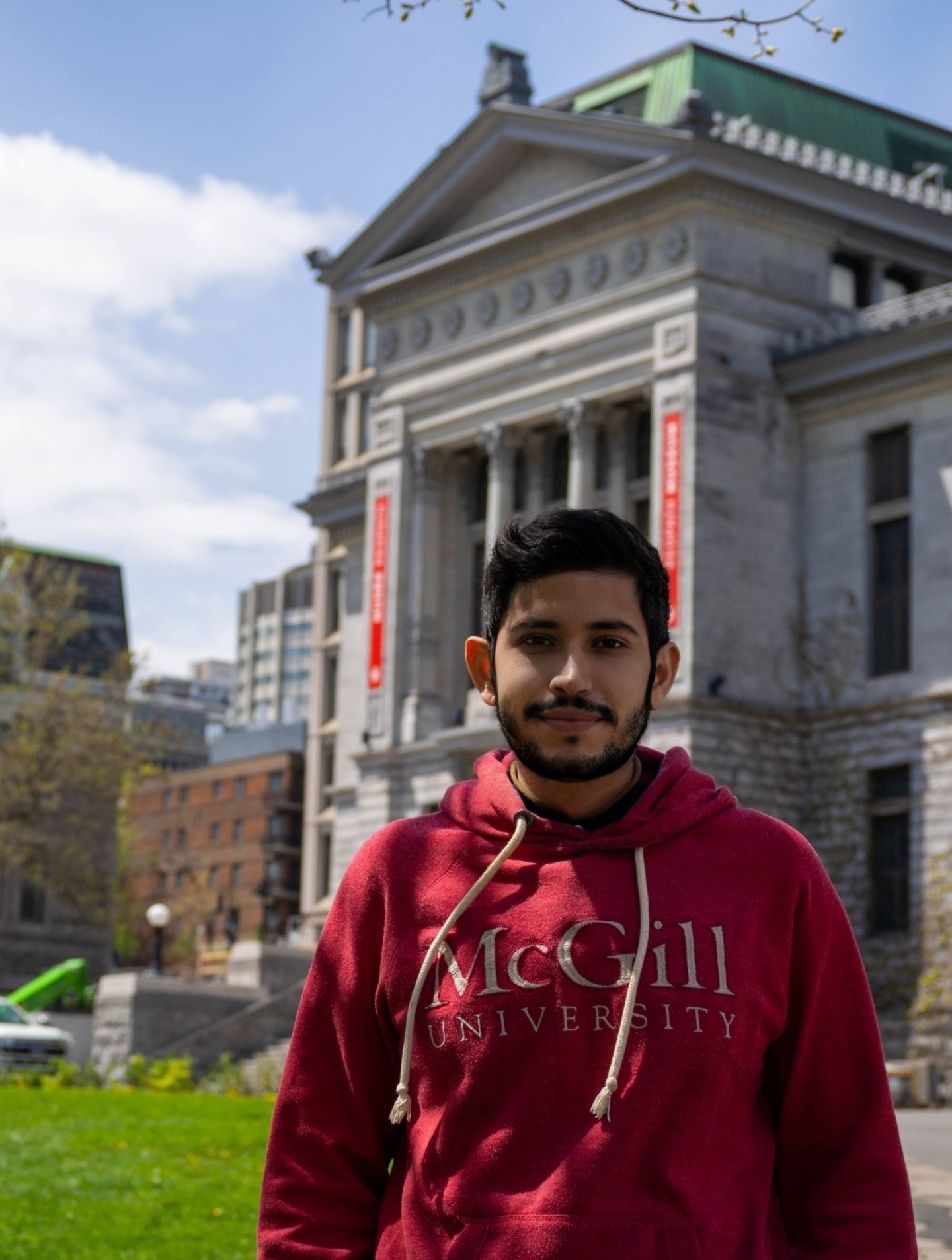 Portrait of Leonardo - Young man wearing a McGill hoodie in front of Redpath museum
