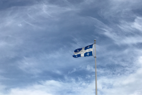 Picture of Quebec flag in a blue sky